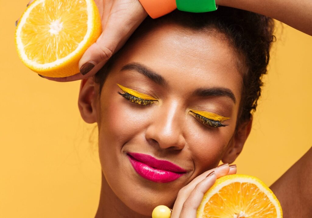 woman with citrus fruit